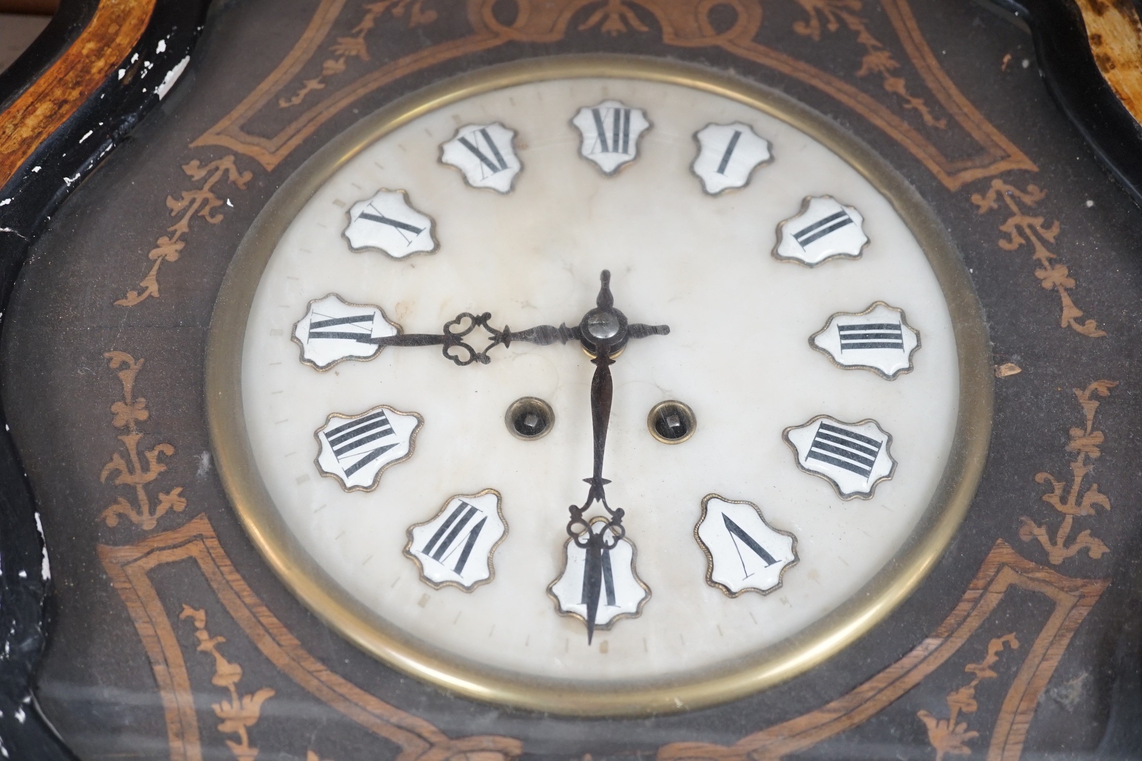 A late 19th century oval French marquetry wall clock with enamel Roman numerals, 62cm high